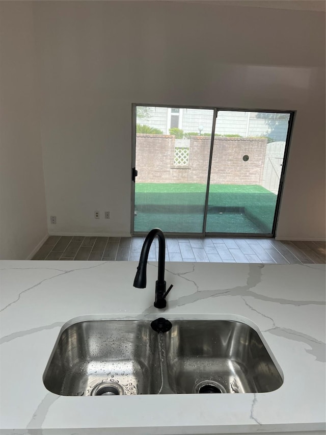 12922 Wirevine Ln, Houston, TX 77072 - kitchen view of light stone countertops and wood finished floors