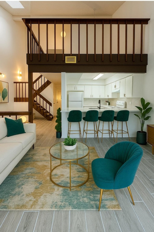 12922 Wirevine Ln, Houston, TX 77072 - living room featuring wood finished floors and stairs