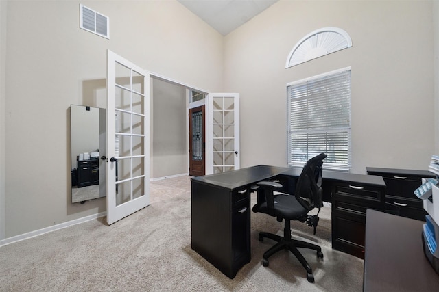 4314 Walden Terrace Ln, Humble, TX 77396 - home office featuring french doors, light colored carpet, and high vaulted ceiling