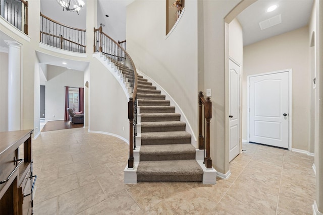 4314 Walden Terrace Ln, Humble, TX 77396 - stairway featuring a towering ceiling and arched walkways