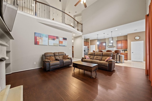 4314 Walden Terrace Ln, Humble, TX 77396 - living room featuring a ceiling fan, wood finished floors, and a high ceiling
