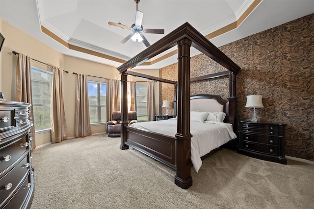 4314 Walden Terrace Ln, Humble, TX 77396 - carpeted bedroom featuring crown molding, a tray ceiling, and ceiling fan