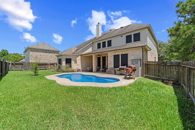 4314 Walden Terrace Ln, Humble, TX 77396 - rear view of property with brick siding, a fenced backyard, a patio area, a chimney, and a ceiling fan
