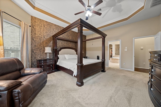 4314 Walden Terrace Ln, Humble, TX 77396 - carpeted bedroom with a raised ceiling, ornamental molding, ensuite bathroom, and ceiling fan
