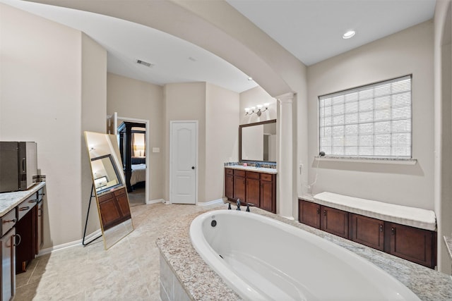 4314 Walden Terrace Ln, Humble, TX 77396 - bathroom with ensuite bath, vanity, a garden tub, decorative columns, and recessed lighting