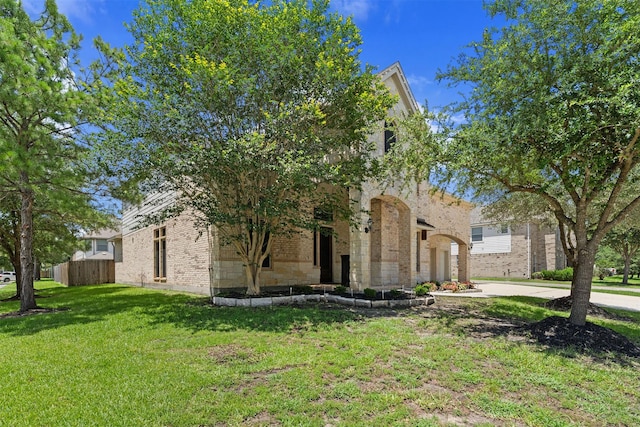4314 Walden Terrace Ln, Humble, TX 77396 - view of front facade featuring a front yard and brick siding