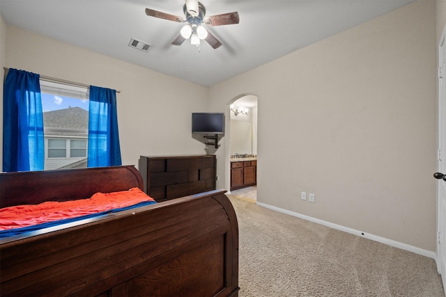 4314 Walden Terrace Ln, Humble, TX 77396 - bedroom featuring light carpet, arched walkways, ceiling fan, and ensuite bath