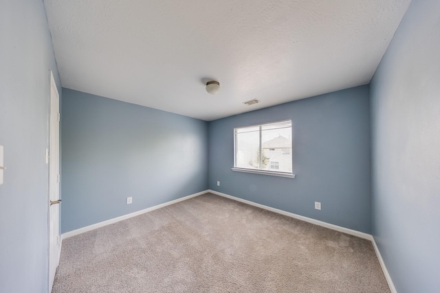 12511 Garden Gale Ln, Houston, TX 77044 - carpeted spare room with baseboards and a textured ceiling