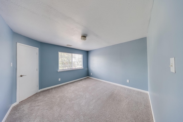 12511 Garden Gale Ln, Houston, TX 77044 - unfurnished room with carpet and a textured ceiling
