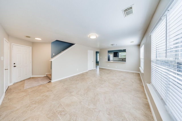 12511 Garden Gale Ln, Houston, TX 77044 - spare room featuring stairway and baseboards