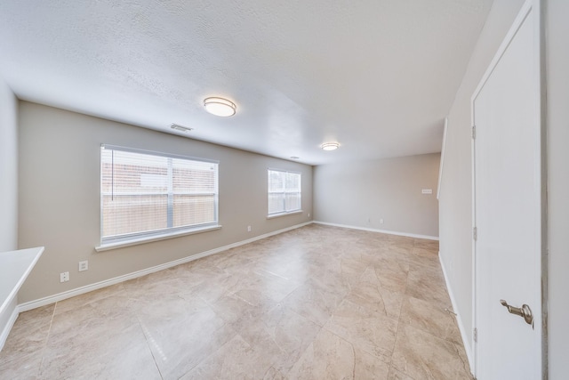 12511 Garden Gale Ln, Houston, TX 77044 - unfurnished room featuring baseboards and a textured ceiling