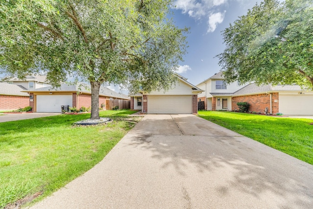 12511 Garden Gale Ln, Houston, TX 77044 - view of front of house with brick siding, a front yard, driveway, and an attached garage