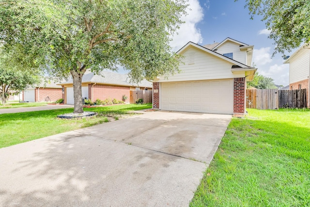 12511 Garden Gale Ln, Houston, TX 77044 - traditional-style home with brick siding, concrete driveway, and an attached garage