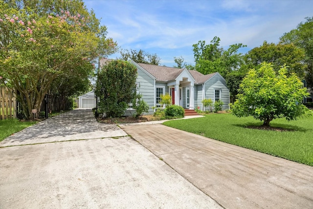 308 W 33rd St, Houston, TX 77018 - obstructed view of property featuring driveway and a gate