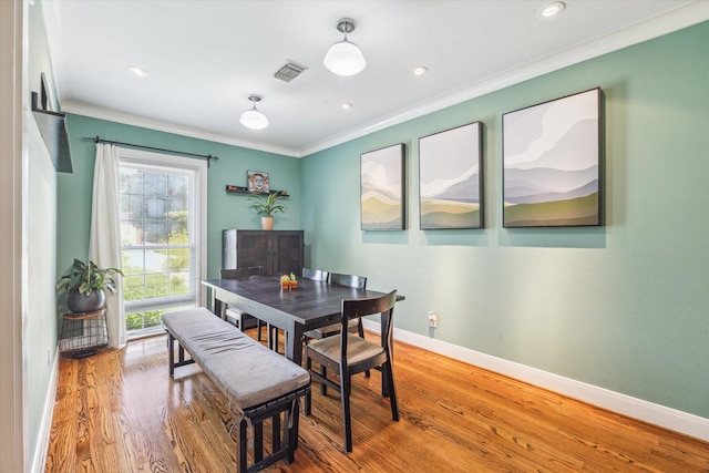 308 W 33rd St, Houston, TX 77018 - dining area with ornamental molding, wood finished floors, and recessed lighting