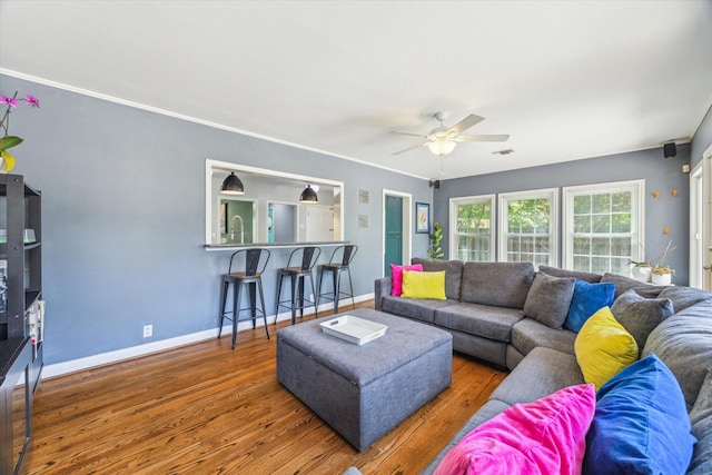 308 W 33rd St, Houston, TX 77018 - living room with a ceiling fan, wood finished floors, and crown molding