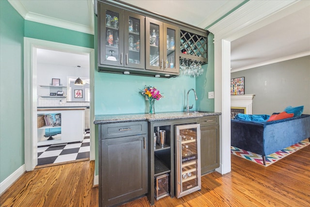 308 W 33rd St, Houston, TX 77018 - indoor wet bar featuring wine cooler, crown molding, and wood finished floors