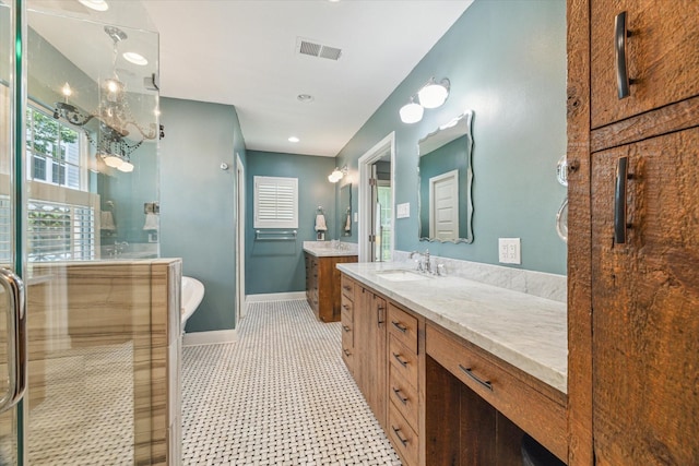 308 W 33rd St, Houston, TX 77018 - bathroom featuring two vanities, a shower stall, and a freestanding tub