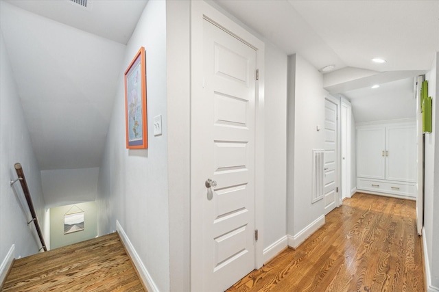 308 W 33rd St, Houston, TX 77018 - hall with an upstairs landing, light wood finished floors, recessed lighting, and vaulted ceiling