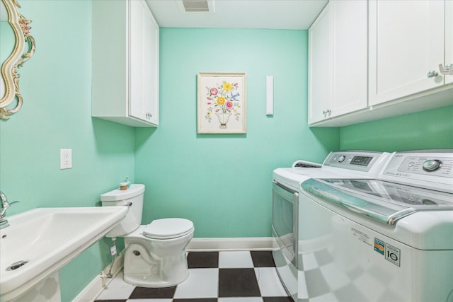 308 W 33rd St, Houston, TX 77018 - washroom featuring washer and clothes dryer and tile patterned floors