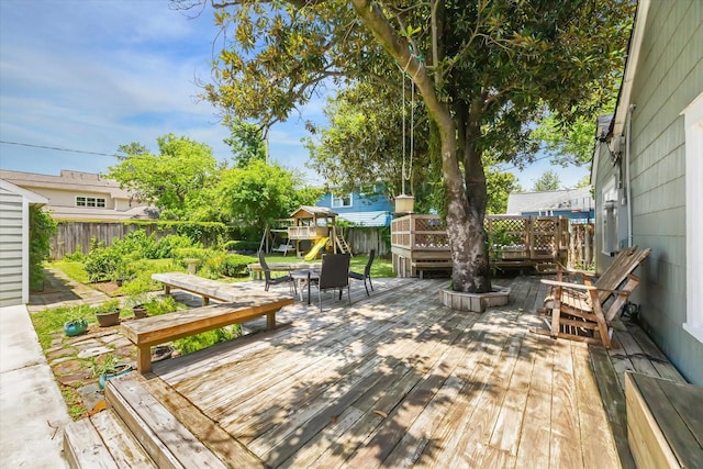 308 W 33rd St, Houston, TX 77018 - wooden deck featuring a fenced backyard and a playground