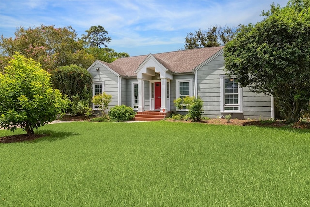 308 W 33rd St, Houston, TX 77018 - ranch-style house featuring a front yard and a shingled roof