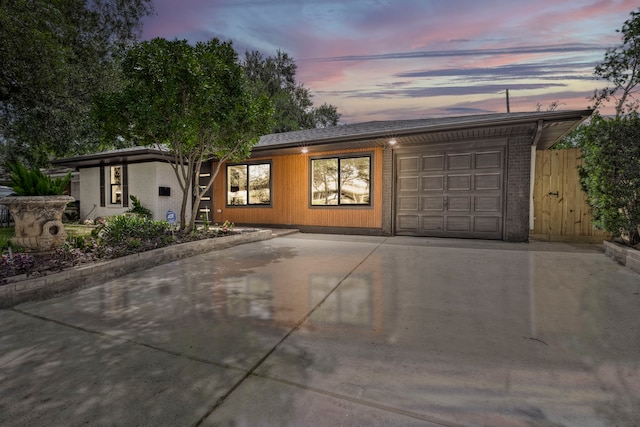 5425 Viking Dr, Houston, TX 77092 - mid-century inspired home featuring an attached garage and concrete driveway