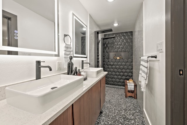 5425 Viking Dr, Houston, TX 77092 - bathroom with double vanity, recessed lighting, and a tile shower