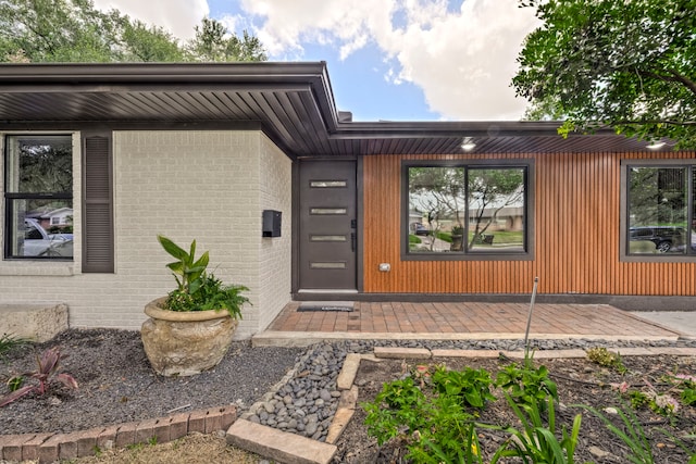 5425 Viking Dr, Houston, TX 77092 - doorway to property featuring brick siding