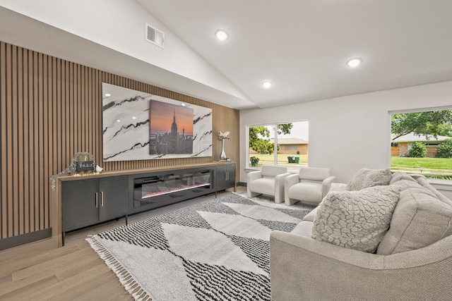 5425 Viking Dr, Houston, TX 77092 - living room featuring lofted ceiling, wood finished floors, and recessed lighting