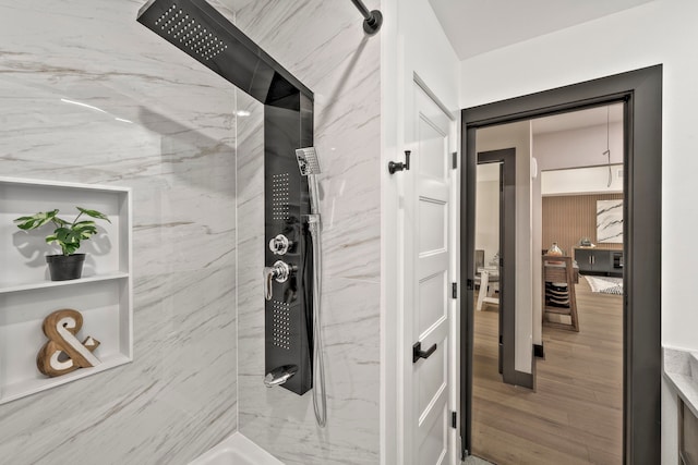 5425 Viking Dr, Houston, TX 77092 - bathroom featuring a shower and wood finished floors