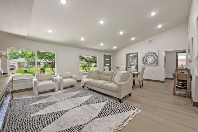 5425 Viking Dr, Houston, TX 77092 - living room with light wood-style flooring, recessed lighting, and vaulted ceiling