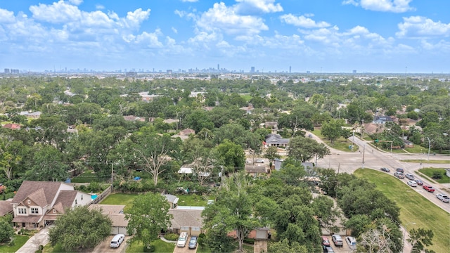 5425 Viking Dr, Houston, TX 77092 - aerial overview of property's location featuring city skyline and a tree filled landscape