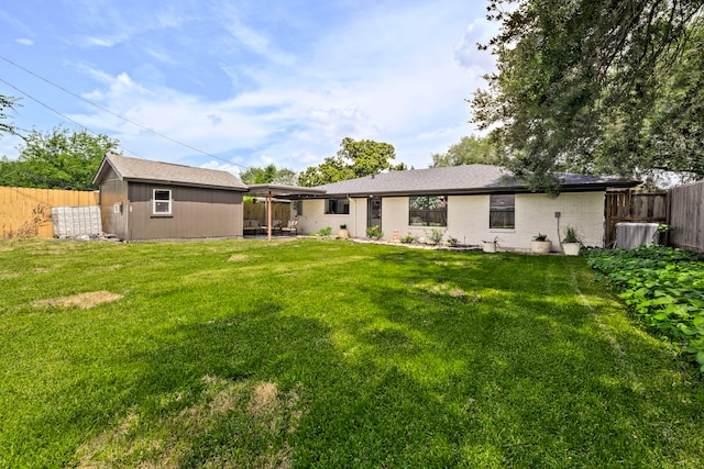 5425 Viking Dr, Houston, TX 77092 - rear view of property with a fenced backyard and a shed
