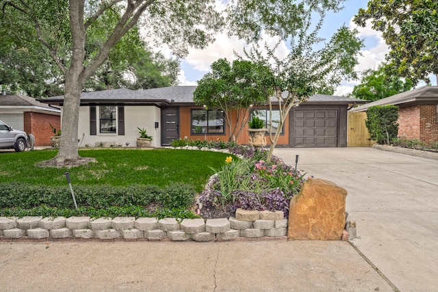 5425 Viking Dr, Houston, TX 77092 - view of front of property with driveway, a garage, a front lawn, and brick siding