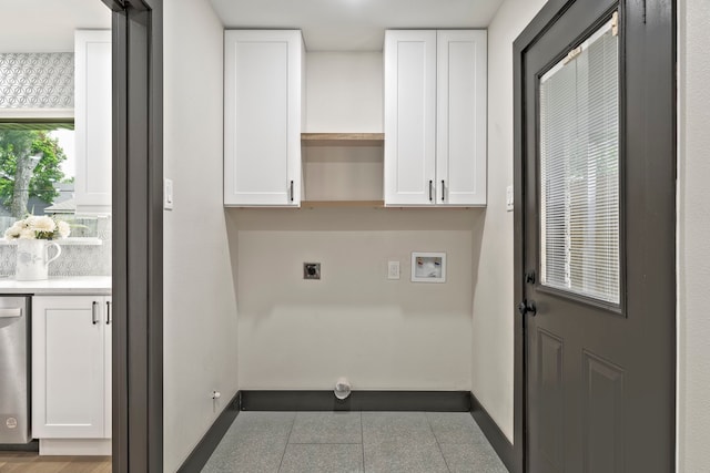 5425 Viking Dr, Houston, TX 77092 - laundry area with electric dryer hookup, washer hookup, and tile patterned flooring