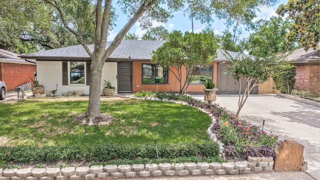 5425 Viking Dr, Houston, TX 77092 - view of front of house featuring a garage, concrete driveway, a shingled roof, a front lawn, and brick siding
