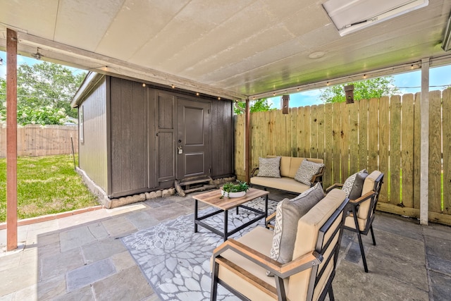 5425 Viking Dr, Houston, TX 77092 - fenced backyard with an outdoor living space, a patio, and a storage unit