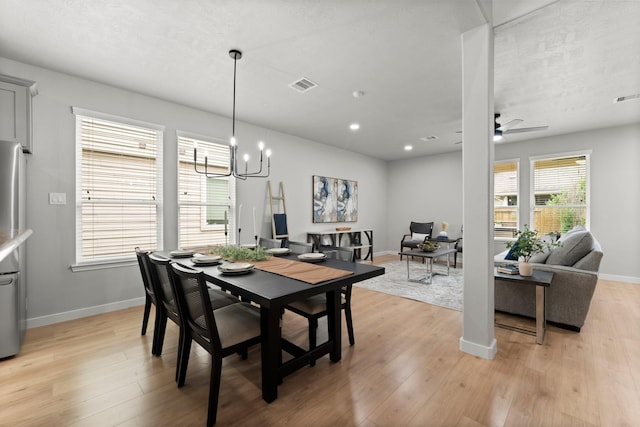 30742 Gardenia Trace Dr, Spring, TX 77386 - dining area featuring a chandelier, light wood-type flooring, and ceiling fan