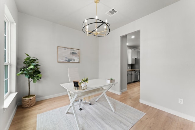 30742 Gardenia Trace Dr, Spring, TX 77386 - office area with light wood finished floors and a chandelier