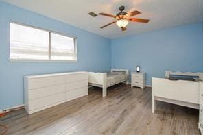 11811 Braesridge Dr, Houston, TX 77071 - bedroom with wood finished floors and ceiling fan