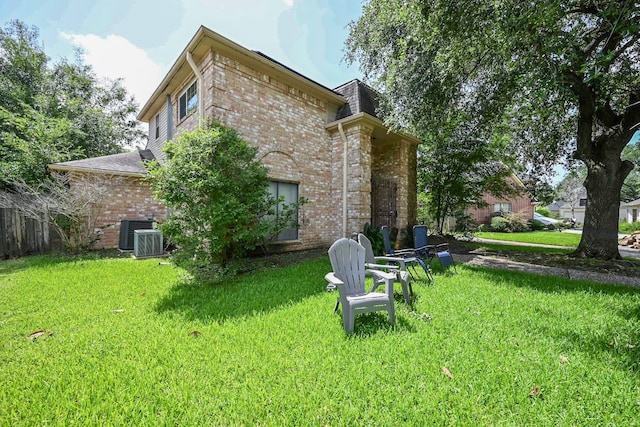 11811 Braesridge Dr, Houston, TX 77071 - back of property featuring brick siding and a lawn