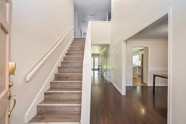 11811 Braesridge Dr, Houston, TX 77071 - staircase with wood finished floors, a high ceiling, and ornamental molding