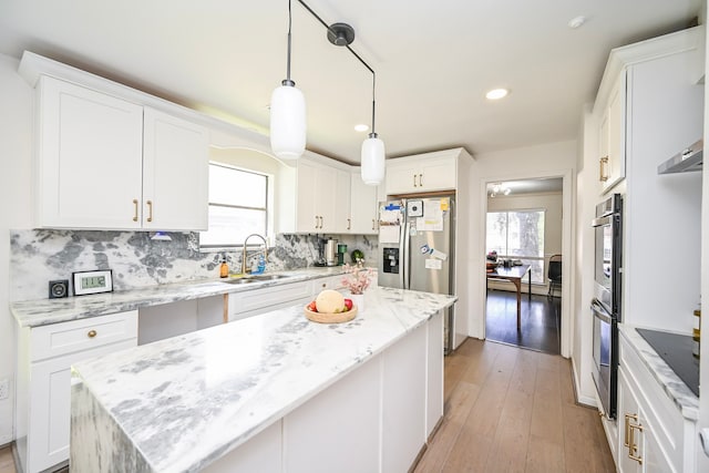 11811 Braesridge Dr, Houston, TX 77071 - kitchen featuring white cabinets, healthy amount of natural light, backsplash, and recessed lighting