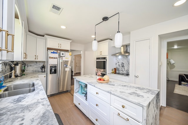 11811 Braesridge Dr, Houston, TX 77071 - kitchen featuring appliances with stainless steel finishes, wall chimney exhaust hood, tasteful backsplash, white cabinets, and recessed lighting