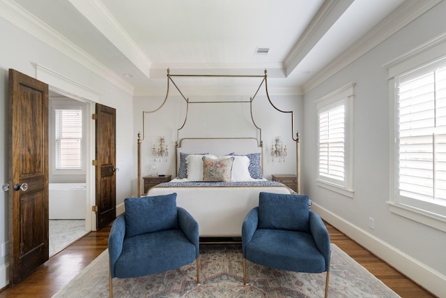 339 W 23rd St Unit A, Houston, TX 77008 - bedroom featuring wood finished floors, crown molding, and a tray ceiling