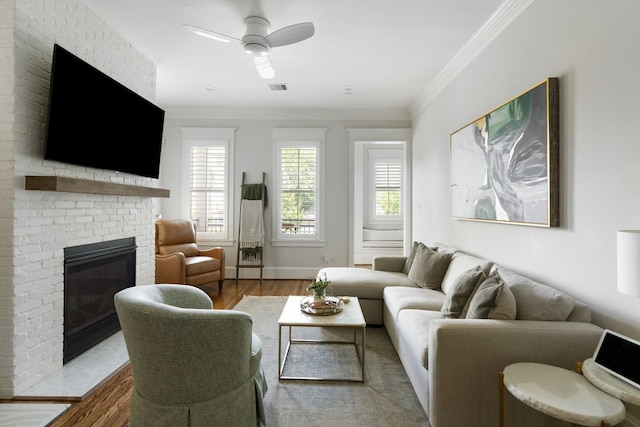 339 W 23rd St Unit A, Houston, TX 77008 - living room featuring wood finished floors, a fireplace, a ceiling fan, and ornamental molding