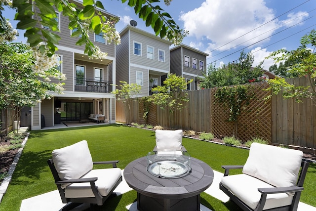 339 W 23rd St Unit A, Houston, TX 77008 - fenced backyard with an outdoor fire pit, a balcony, and a patio area