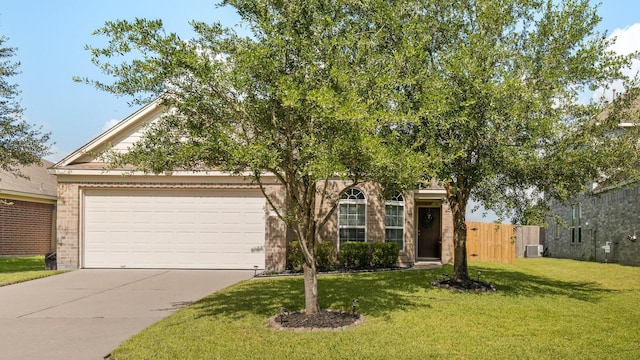15006 Zenith Glen Ln, Cypress, TX 77429 - view of property hidden behind natural elements with concrete driveway, an attached garage, and brick siding