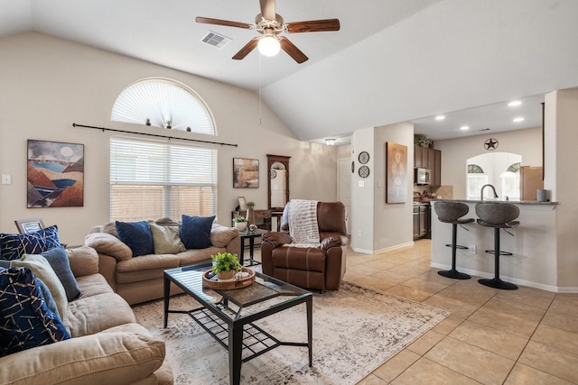 15006 Zenith Glen Ln, Cypress, TX 77429 - living room with light tile patterned floors, ceiling fan, high vaulted ceiling, and recessed lighting